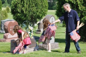 Mary and Kate Tierney with their dad at Evergreen Cemetery